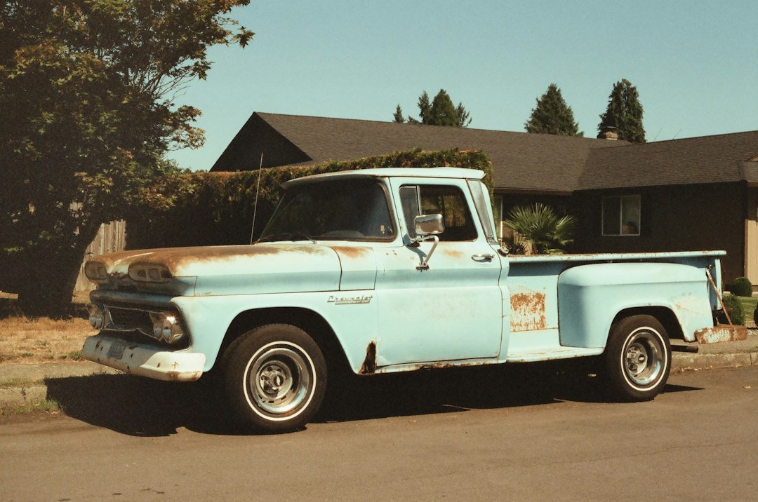 Junk removal truck parked outside a residential home
